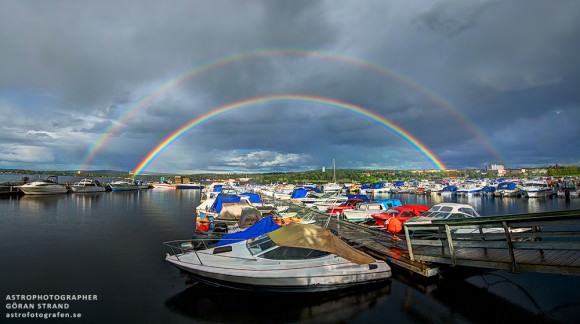 Double rainbow over a marina in Sweden on August 19, 2013. Credit and copyright: Göran Strand
