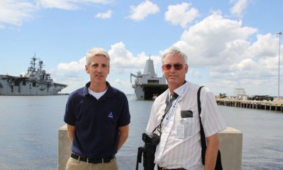 Scott Wilson, NASA’s Orion production manager and Ken Kremer, Universe Today discuss the Aug. 15 recovery test back dropped by Orion and the USS Arlington.  Credit: Ken Kremer/kenkremer.com