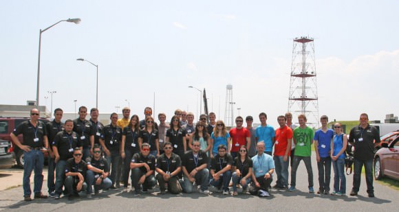 More than 40 University students participating in the Aug. 13 RockSat-X science payload pose for photo op with the Terrier-Improved Malemute sounding rocket that will launch their own experiments to space from NASA Wallops Flight Facility, VA.  Credit: Ken Kremer/kenkremer.com