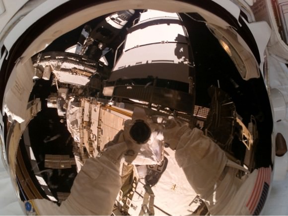 Rick Mastracchio takes a selfie during a spacewalk on STS-118. NASA's web page says the purpose was to have a photo of his helmet visor. Credit: NASA