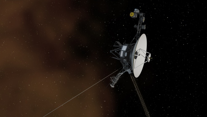 This artist's concept shows the Voyager 1 spacecraft entering the space between stars. Interstellar space is dominated by plasma, ionized gas (illustrated here as brownish haze), that was thrown off by giant stars millions of years ago.Credit: NASA.