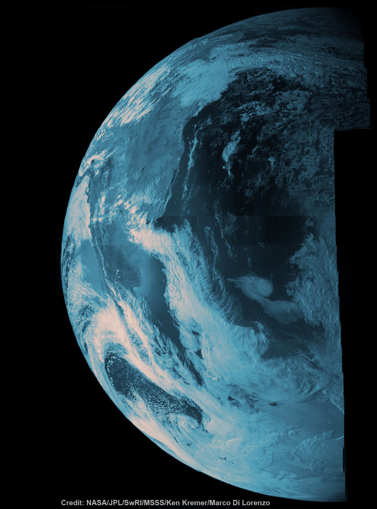 NASA's Juno probe captured the image data for this composite picture during its Earth flyby on Oct. 9 over Argentina,  South America and the southern Atlantic Ocean. Raw imagery was reconstructed and aligned by Ken Kremer and Marco Di Lorenzo, and false-color blue has been added to the view taken by a near-infrared filter that is typically used to detect methane. Credit: NASA/JPL/SwRI/MSSS/Ken Kremer/Marco Di Lorenzo