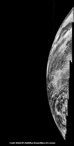 Dayside view of a sliver of Earth snapped by Juno during flyby on Oct. 9, 2013.  This mosaic has been reconstructed from raw image data captured by methane infrared filter on Junocam imager at 11:57:30 PDT.  Credit: NASA/JPL/SwRI/MSSS/Ken Kremer/Marco Di Lorenzo 