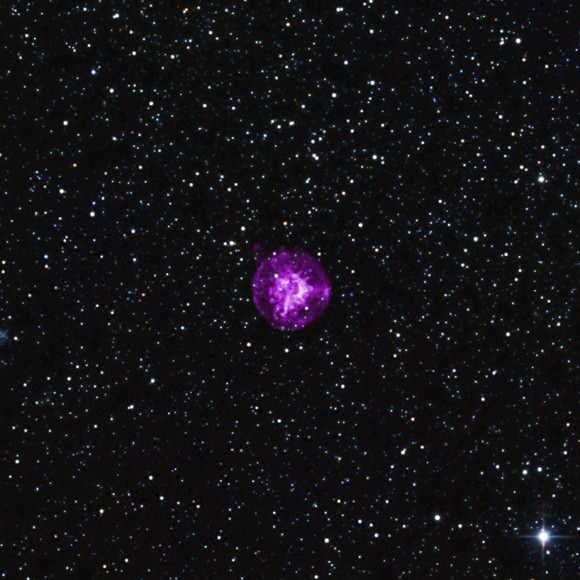 SNR B0049-73.6 in X-ray and infrared light.  Chandra's observations (purple) revealed that the explosion seen here was likely from a star's central core collapse. Infrared data from the 2MASS survey is also visible in red, green and blue. Credit: X-ray: NASA/CXC/Drew Univ/S.Hendrick et al, Infrared: 2MASS/UMass/IPAC-Caltech/NASA/NSF