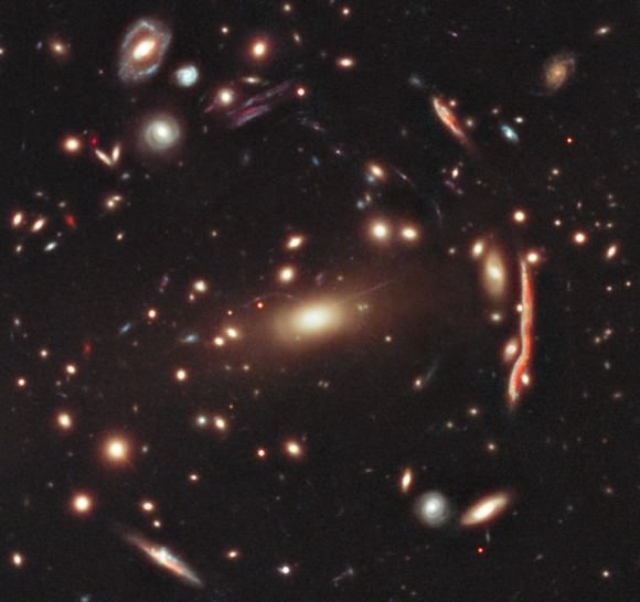 The Hubble Space Telescope shows the effect of gravitational lensing as background galaxies are warped by the galaxy cluster MACS J1206. Image Credit: NASA