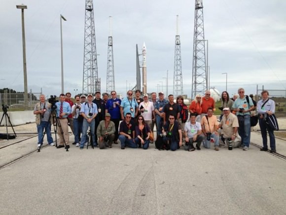 Photojournalists and space reporters (including Ken Kremer of Universe Today) covering the MAVEN Mars orbiter launch pose for group photo op in front of the Atlas V rocket poised to blastoff from Launch Complex 41 at Cape Canaveral Air Force Station on Nov. 18, 2013. Credit: Nicolle Solomon