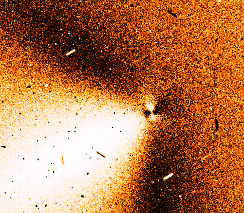 Photo taken through the TRAPPIST 60-cm telescope using a narrowband CN (390 nm) filter shows two active jets in ISON's inner coma (right) and a broad dust tail at left. Credit: Cyrielle Opitom, TRAPPIST team 
