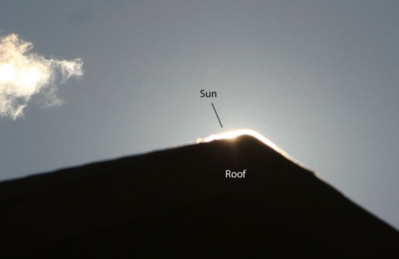 Example using a rooftop to block the sun so you can search near it for any sign of the comet. If using binoculars, BE SURE you focus them at infinity before daytime comet hunting otherwise there's no way to know if the comet will be in focus. I use clouds (the best) or a distant treeline. Credit: Bob King