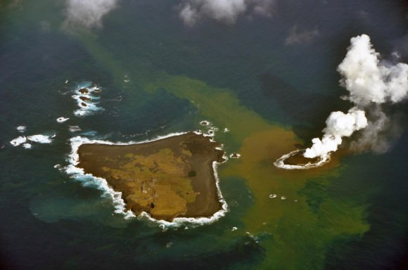 An erupting undersea volcano forms a new island, shown by its nearest neighbor, Nishinoshima, a small unihabited island in the southern Ogasawara chain of islands. The image was taken on November 21, 2013 by the Japanese Coast Guard.
