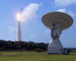 A 50-foot (15-meter) tracking dish at the European Space Agency's tracking station at Kourou, French Guiana. In the background is the successful Herschel and Planck launch of May 14, 2009. Credit: ESA/A. Chance