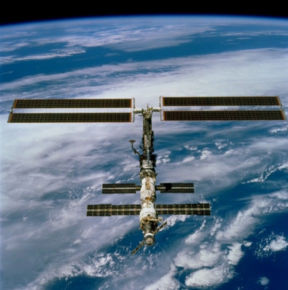 The space station with newly installed U.S. solar arrays (top) in December 2000. Picture taken by the departing STS-97 crew aboard space shuttle Endeavour. Credit: NASA