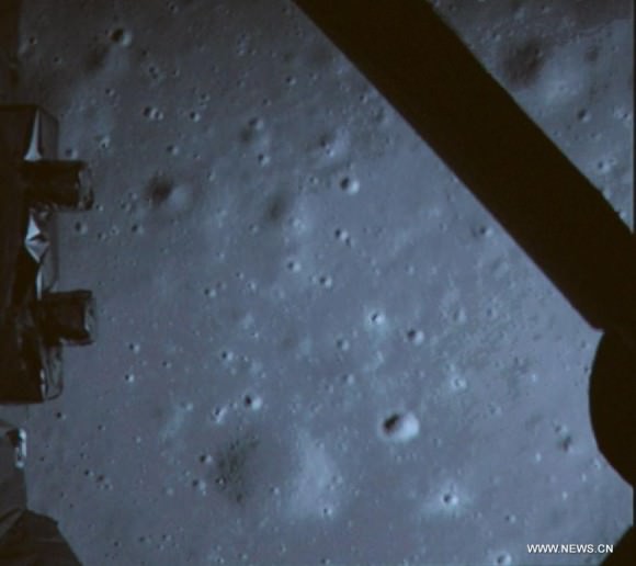 Photo taken on Dec. 14, 2013 shows a picture of the moon surface taken by the on-board camera of lunar probe Chang'e-3 on the screen of the Beijing Aer Control Center in Beijing.   This marks the first time that China has sent a spacecraft to soft land on the surface of an extraterrestrial body.  Credit: Xinhua/CCTV