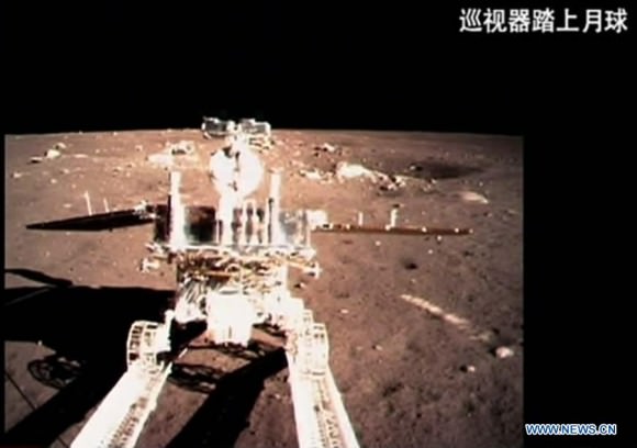 A video grab shows China's first moon rover, Yutu, or Jade Rabbit, separating from Chang'e-3 moon lander early Dec. 15, 2013. The six-wheeled rover separated from the lander early on Sunday, several hours after the Chang'e-3 probe soft-landed on the lunar surface.  Credit: Xinhua