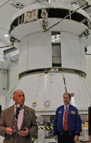 NASA Administrator Charles Bolden discusses NASA’s human spaceflight initiatives backdropped by the service module for the Orion crew capsule being assembled at the Kennedy Space Center.  Credit: Ken Kremer/kenkremer.com 