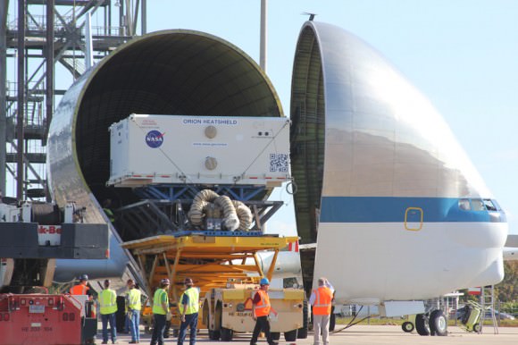 Orion EFT-1 heat shield is off loaded from NASA’s Super Guppy aircraft after transport from Manchester, N.H., and arrival at the Kennedy Space Center in Florida on Dec. 5, 2013. Credit: Ken Kremer/kenkremer.com