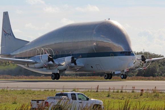 Departure of NASA’s Super Guppy from the shuttle landing runway at the Kennedy Space Center in Florida on Dec. 5, 2013 after removal of Orion heat shield.  Credit: Ken Kremer/kenkremer.com