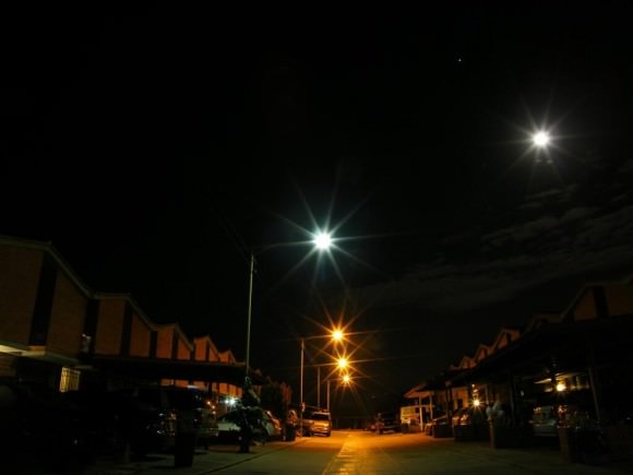 The MiniMoon versus streetlights as seen from Nueva Casarapa, Venezulua. Credit: Jose Mauricio Rozada (@jmrozada) 