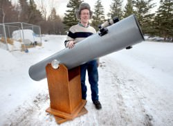 The writer with his 10-inch Dobsonian reflecting telescope. The scope comes in two pieces like John Dobson's original design - a cardboard tube with the optics that sits in a cradle. See photo below to see how a "Dob" works. Credit: Bob King