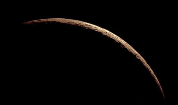An 18-hour-old crescent moon photographed in a 12-inch telescope on April 22, 2012. Credit and copyright: John Chumack and Maurice Massey