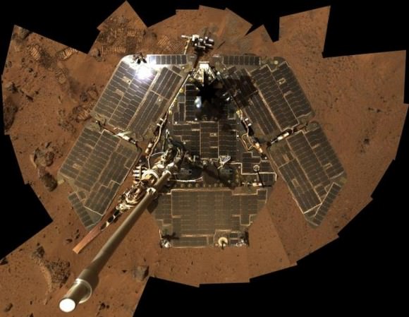 In this selfie, Spirit shows her solar panels gleaming in the Martian sunlight and carrying only a thin veneer of dust two years after the rover landed and began exploring the red planet. Spirit's panoramic camera took this mosaic of images on Sol 586 (Aug. 27, 2005), as part of a mammoth undertaking. The vertical projection used here produces the best view of the rover deck itself, though it distorts the ground and antennas somewhat. This image is an approximate true-color rendering that combines images taken through the camera's 600-nanometer, 530-nanometer and 480-nanometer filters. Credit: NASA/JPL-Caltech/Cornell 