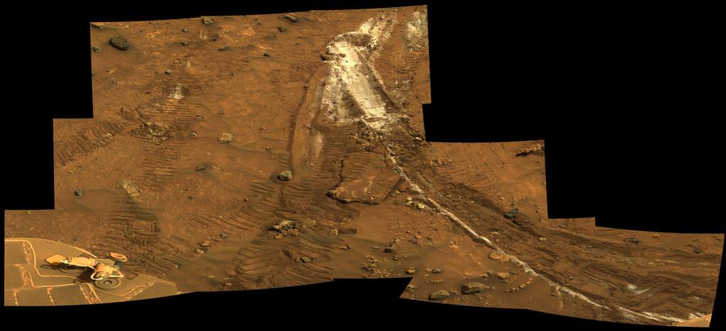 Spirit acquired this mosaic on Sol 1202  (May 21, 2007), while investigating the area east of the elevated plateau known as "Home Plate" in the "Columbia Hills." The mosaic shows an area of disturbed soil, nicknamed "Gertrude Weise" by scientists, made by Spirit's stuck right front wheel. The trench exposed a patch of nearly pure silica, with the composition of opal. It could have come from either a hot-spring environment or an environment called a fumarole, in which acidic, volcanic steam rises through cracks. Either way, its formation involved water, and on Earth, both of these types of settings teem with microbial life. Credit: NASA/JPL-Caltech/Cornell