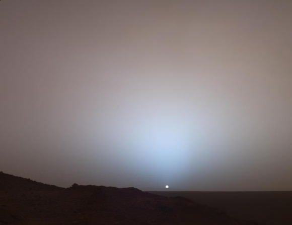 A Moment Frozen in Time On May 19th, 2005, NASA's Mars Exploration Rover Spirit captured this stunning view as the Sun sank below the rim of Gusev crater on Mars. This Panoramic Camera (Pancam) mosaic was taken around 6:07 in the evening of Sol 489. The terrain in the foreground is the rock outcrop "Jibsheet," a feature that Spirit has been investigating for several weeks (rover tracks are dimly visible leading up to "Jibsheet"). The floor of Gusev crater is visible in the distance, and the Sun is setting behind the wall of Gusev some 80 km (50 miles) in the distance. Credit: NASA/JPL-Caltech/Texas A&M/Cornell