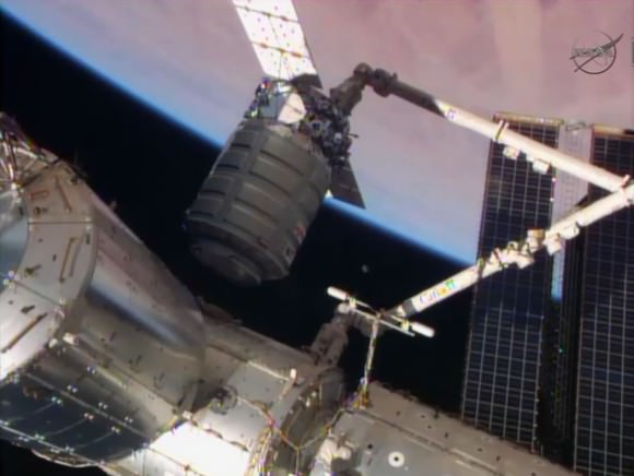 ISS Astronauts grapple Orbital Sciences Cygnus spacecraft with robotic arm and guide it to docking port. Credit: NASA TV
