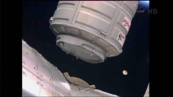 Orbital Sciences' Cygnus cargo spacecraft, with the moon seen in the background, is moved into installation position by astronauts using a robotic arm aboard the International Space Station Jan. 12. Credit: NASA