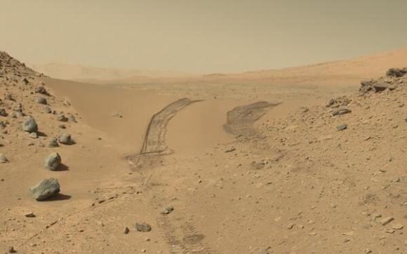 The Curiosity rover looks back at the tracks it left after crossing through the Dingo Gap sand dune. Credit: NASA/JPL, Caltech. Via Doug Ellison on Twitter. 