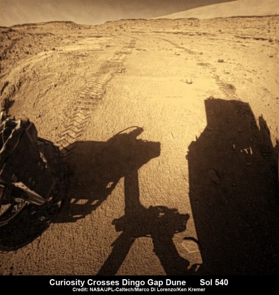 Curiosity looks back to ‘Dingo Gap’ sand dune after crossing over, backdropped by Mount Sharp on Sol 540, Feb. 12, 2014.  Rear hazcam fisheye image linearized and colorized.  Credit: NASA/JPL/Marco Di Lorenzo/Ken Kremer- kenkremer.com  