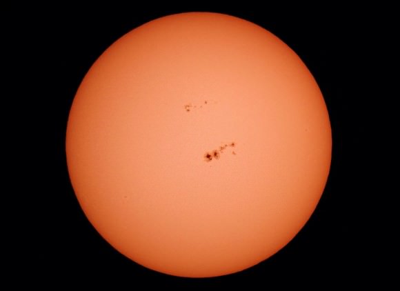 The huge sunspot group 1967 straddles the center of the solar disk on Feb. 3, 2014. Details: 6-inch reflector with Baader solar filter, 1/2000 exposure, ISO 400. Credit: John Chumack