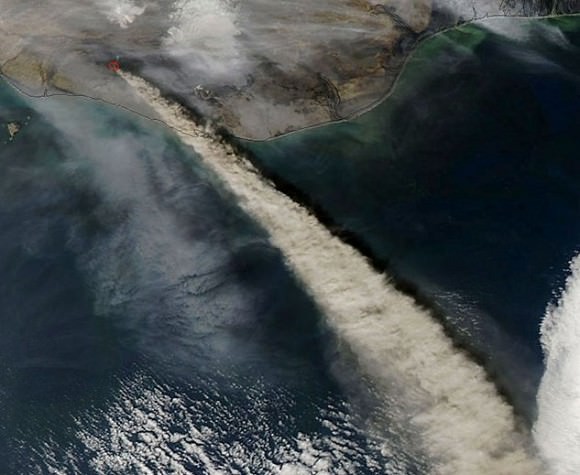 The expanding ash cloud spewing from Iceland's Eyjafjallajökull volcano as seen from space in 2010. Credit: NASA.
