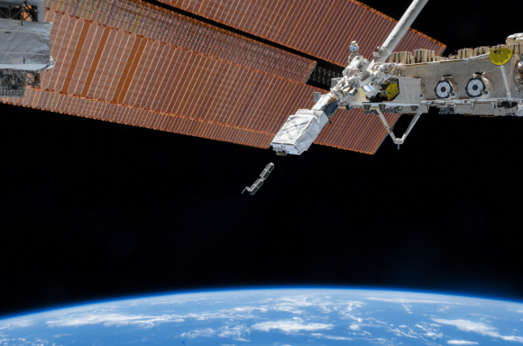 The Japanese Kibo robotic arm on the International Space Station deploys CubeSats during February 2014. The arm was holding a Small Satellite Orbital Deployer to send out the small satellites during Expedition 38. Credit: NASA