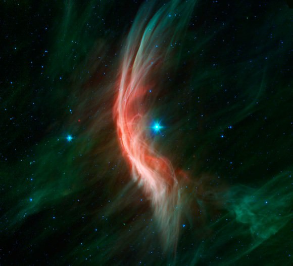 The bow shock of Zeta Ophiuchi, another runaway star observed by Spitzer (NASA/JPL-Caltech)