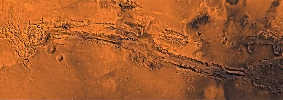Valles Marineris as seen in this mosaic of Viking orbiter images. Noctis Labyrinthus at the left, Melas Chasma in the middle, Hebes Chasma just left of top center, Eos Chasma at lower right and Ganges Chasma just above center right. Credit: NASA/JPL