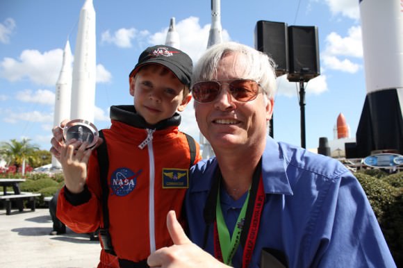 Connor Johnson (Future astronaut) and Ken Kremer (Universe Today) at the ceremony with former space shuttle commander Bob Cabana, on March 15, at the Kennedy Space Center Visitor Complex. Connor holds the ISS bolt given to him by Cabana. Johnson, of Denver, Colo., initiated a petition to the White House to maintain NASA funding. Credit: Jason Rhian/Spaceflight Insider