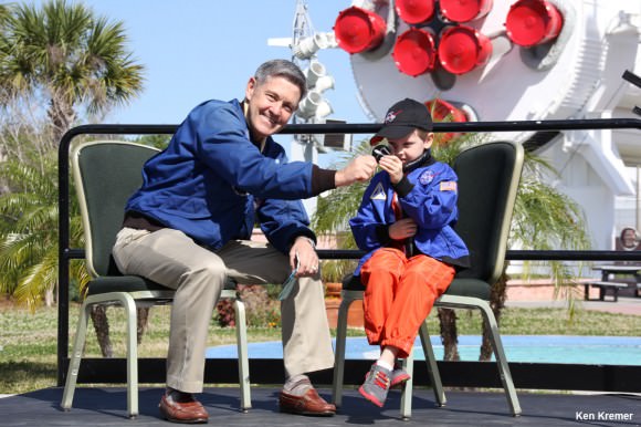 Connor Johnson, 6, talks with former space shuttle commander Bob Cabana, director of Kennedy Space Center, about spaceflight during a ceremony Saturday, March 15, at the Kennedy Space Center Visitor Complex. Connor holds the ISS bolt given to him by Cabana in appreciation of Connor initiating a petition to the White House to maintain NASA funding.  Credit: Ken Kremer - kenkremer.com