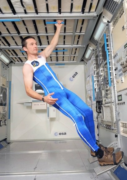 A model poses in the "skinsuit", a tight-fitting garment being tested to counteract back pain in space. Credit: ESA