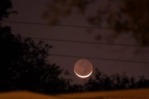 The young thin Crescent Moon with Earthshine was hanging low in the west near Tampa, Florida on March 2, 2014. Credit and copyright: John Chumack.  