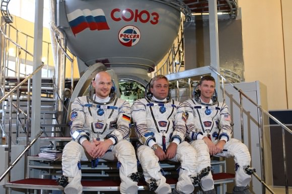 The crew members of Expedition 40/41 pose in front of a Soyuz spacecraft simulator in Star City, Russia. From left, Alex Gerst (European Space Agency), Max Suraev (Roscosmos) and Reid Wiseman (NASA). Credit: NASA