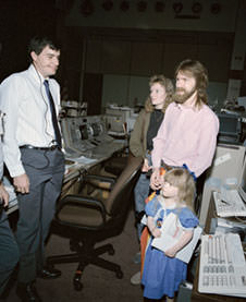 The Shelton family during a visit to NASA Mission Control in Houston in 1990. From left, NASA's Steve Stitch, Terry Shelton, Mark Shelton and daughter MacKenzie.  They have been sending flowers to NASA regularly since shuttle mission STS-26 in 1988. Credit: NASA