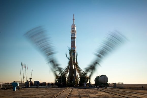 Structure arms for Soyuz TMA-11M (the launching vehicle for Expedition 38) raise into place in this long-exposure photograph taken in Kazakhstan. Credit: NASA/Bill Ingalls