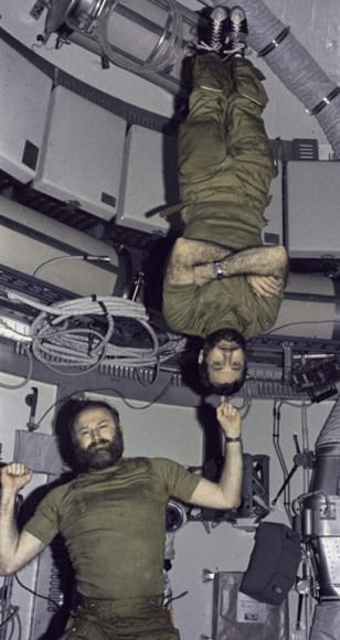 Skylab 4 NASA astronaut Bill Pogue (upside-down) with Jerry Carr. The mission ran from Nov. 16, 1973, to Feb. 8, 1974. Credit: NASA