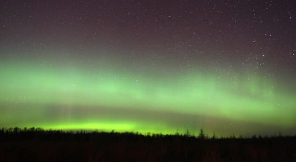 After an intial flurry of bright rays, the aurora scaled back to two bright, diffuse arcs before erupting again around 11:30 p.m. Credit: Bob King
