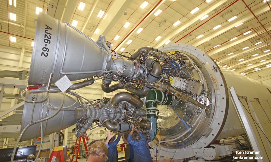 Soviet era NK-33 engines refurbished as the AJ26 exactly like pictured here probably caused Antares’ rocket failure on Oct. 28, 2014. Orbital Sciences technicians at work on two AJ26 first stage engines at the base of an Antares rocket during exclusive visit by Ken Kremer/Universe Today at NASA Wallaps. These engines powered the successful Antares liftoff on Jan. 9, 2014 at NASA Wallops, Virginia bound for the ISS. Credit: Ken Kremer – kenkremer.com