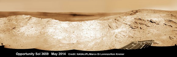 NASA’s Opportunity Mars rover captures sweeping panoramic vista near the ridgeline of 22 km (14 mi) wide Endeavour Crater’s western rim. The center is southeastward and also clearly shows the distant rim. See the complete panorama below. This navcam panorama was stitched from images taken on May 10, 2014 (Sol 3659) and colorized. Credit: NASA/JPL/Cornell/Marco Di Lorenzo/Ken Kremer-kenkremer.com