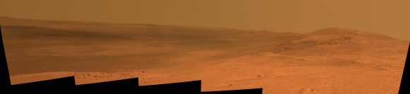 This vista of the Endeavour Crater rim was acquired by NASA's Mars Exploration Rover Opportunity's panoramic camera on April 18, 2014, from the southern end of "Murray Ridge" on the western rim of the crater. In mid-May, the rover approached the dark outcrops on the flank of the hill at right. The high peak in the distance on the right is informally named "Cape Tribulation" and is about 1.2 miles (2 kilometers) to the south of Opportunity's position when this view was recorded Credit: NASA/JPL-Caltech/Cornell Univ./Arizona State Univ. 
