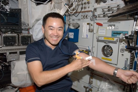 Expedition 32 astronaut Aki Hoshide with a fistfull of blood samples on the International Space Station in 2012. Credit: NASA