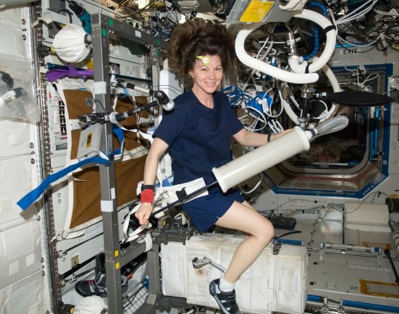 Expedition 26's Cady Coleman (NASA) calibrates a device intended to measure oxygen production while sitting on the Cycle Ergometer with Vibration Isolation System (CEVIS) in the Destiny laboratory of the International Space Station. Credit: NASA