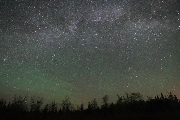 Airglow across the eastern sky below the summertime Milky Way. Notice that unlike the vertical rays and gently curving arcs of the aurora, airglow is banded and streaky and in places almost fibrous. Credit: Bob King